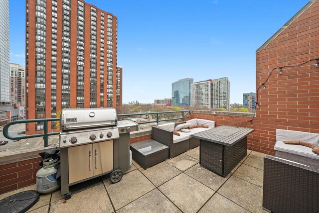 801 S Plymouth Ct Unit 602, Chicago, IL 60605 - view of patio with an outdoor hangout area, area for grilling, and a view of city