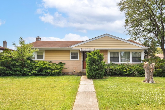 2727 Pauline Ave, Glenview, IL 60025 - view of front of house with brick siding, a front yard, and a chimney