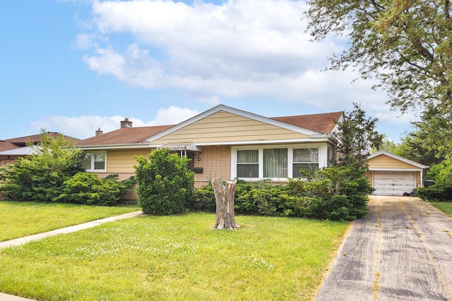 2727 Pauline Ave, Glenview, IL 60025 - view of front of property with an outdoor structure, a front yard, a detached garage, brick siding, and concrete driveway
