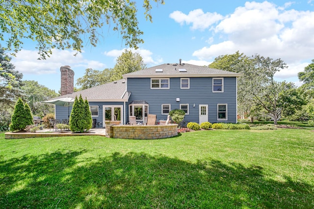 963 Monticello Dr, Naperville, IL 60563 - back of property featuring a patio area, a yard, and a chimney