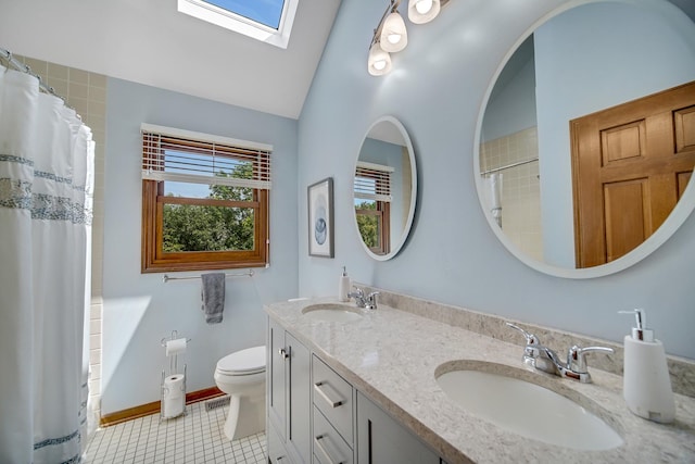963 Monticello Dr, Naperville, IL 60563 - bathroom featuring double vanity, a skylight, a shower with shower curtain, tile patterned flooring, and lofted ceiling