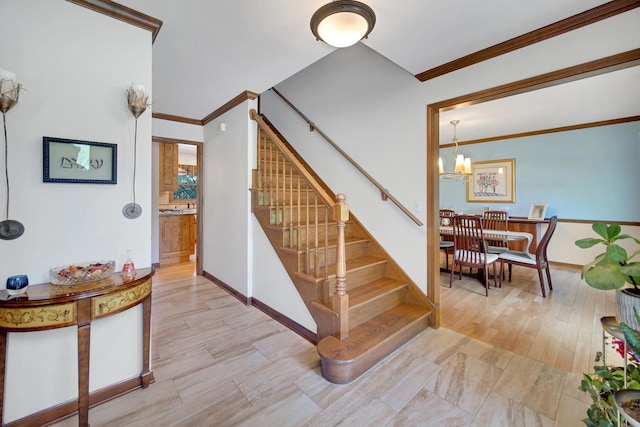 963 Monticello Dr, Naperville, IL 60563 - staircase with a chandelier, ornamental molding, and wood finished floors
