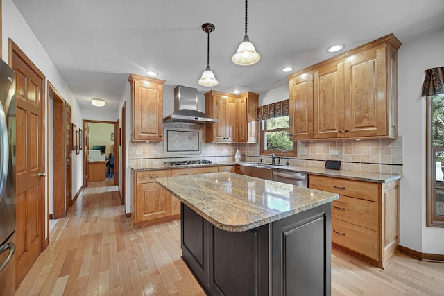 963 Monticello Dr, Naperville, IL 60563 - kitchen with wall chimney exhaust hood, appliances with stainless steel finishes, light wood-style floors, tasteful backsplash, and light stone counters