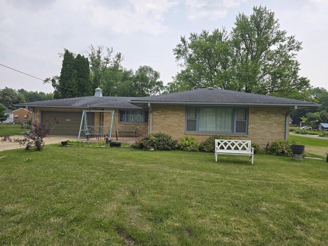 2916 School St, Rockford, IL 61101 - single story home featuring an attached garage, a front yard, brick siding, and driveway