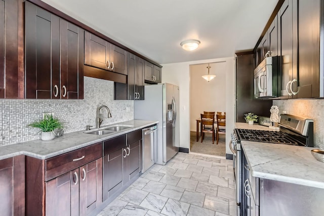 1240 Winfield Ct Unit 4, Roselle, IL 60172 - kitchen featuring appliances with stainless steel finishes, tasteful backsplash, light stone counters, and dark brown cabinets