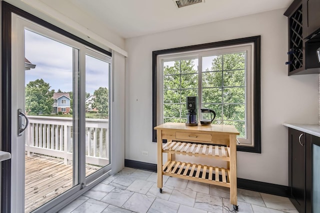 1240 Winfield Ct Unit 4, Roselle, IL 60172 - doorway featuring baseboards and light marble finish floors