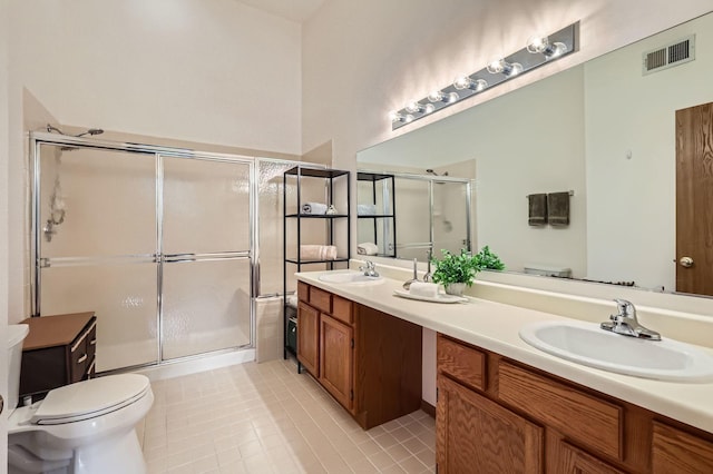 1240 Winfield Ct Unit 4, Roselle, IL 60172 - bathroom featuring double vanity, a shower stall, and tile patterned floors