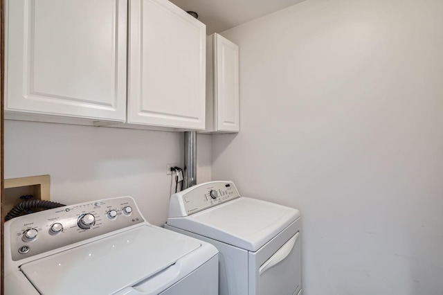 1240 Winfield Ct Unit 4, Roselle, IL 60172 - laundry area with cabinet space and washing machine and clothes dryer