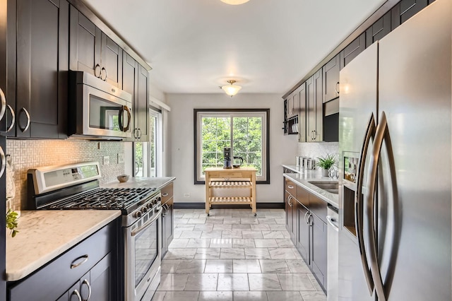 1240 Winfield Ct Unit 4, Roselle, IL 60172 - kitchen with appliances with stainless steel finishes and backsplash