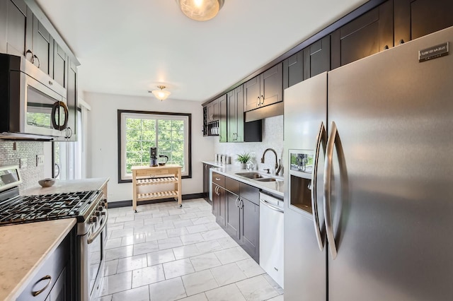 1240 Winfield Ct Unit 4, Roselle, IL 60172 - kitchen with stainless steel appliances, backsplash, light countertops, and light marble finish flooring