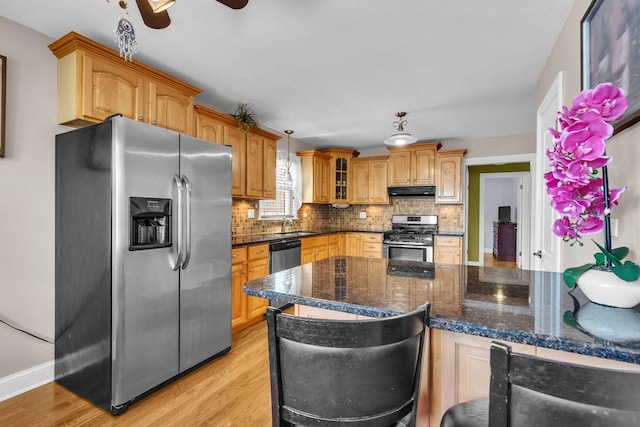 7644 W Norridge St, Norridge, IL 60706 - kitchen with stainless steel appliances, backsplash, light wood-style floors, glass insert cabinets, and a ceiling fan