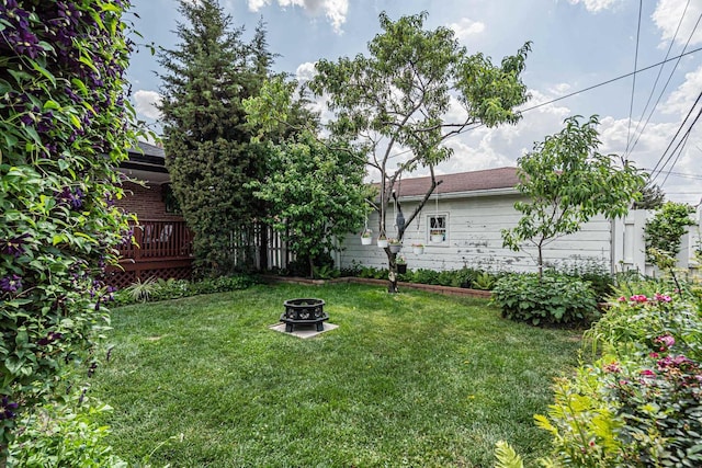 7644 W Norridge St, Norridge, IL 60706 - view of green lawn featuring a fire pit and a deck