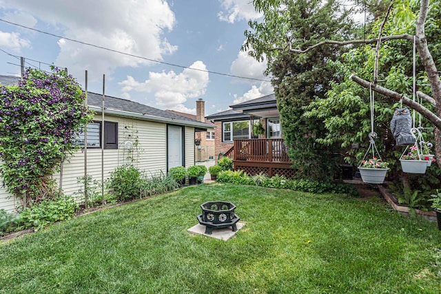 7644 W Norridge St, Norridge, IL 60706 - view of grassy yard featuring a deck and a fire pit