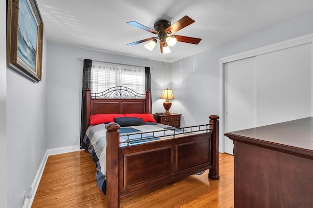 7644 W Norridge St, Norridge, IL 60706 - bedroom with light wood-type flooring, a closet, and a ceiling fan