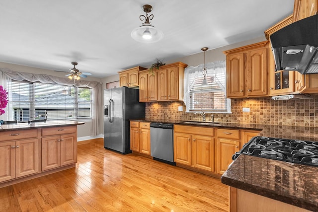 7644 W Norridge St, Norridge, IL 60706 - kitchen with appliances with stainless steel finishes, ventilation hood, hanging light fixtures, light wood-type flooring, and ceiling fan