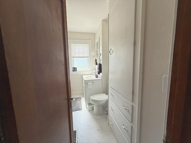 405 N Division Ave, Polo, IL 61064 - bathroom featuring marble look tile flooring and vanity
