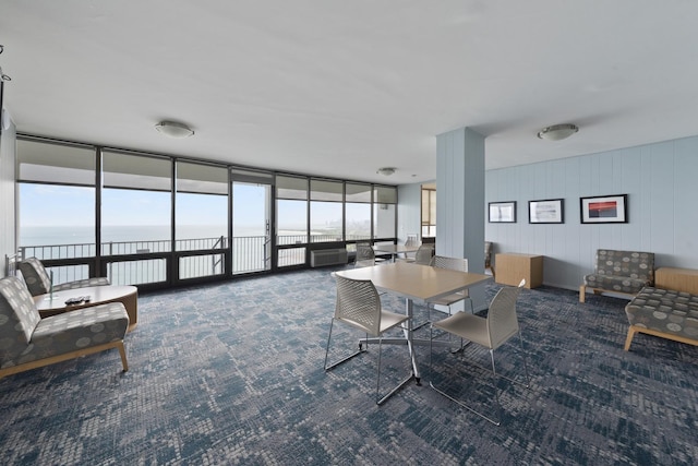 940 W Glenlake Ave Unit 24C, Chicago, IL 60660 - dining room with carpet flooring, a water view, and a wall of windows
