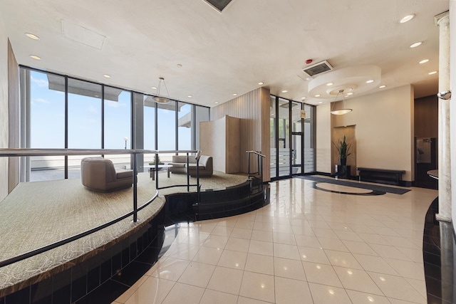 940 W Glenlake Ave Unit 24C, Chicago, IL 60660 - building lobby featuring floor to ceiling windows and recessed lighting