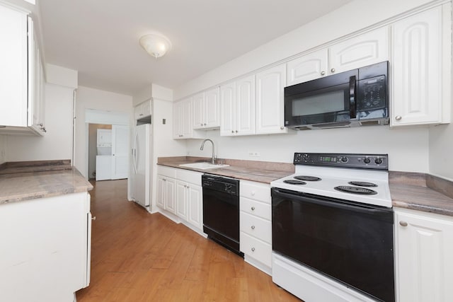 940 W Glenlake Ave Unit 24C, Chicago, IL 60660 - kitchen with black appliances, white cabinets, and light wood-style flooring