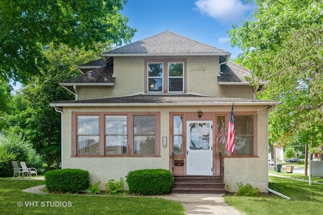154 N Fremont St, Palatine, IL 60067 - view of front of house featuring stucco siding, entry steps, a front lawn, and a shingled roof