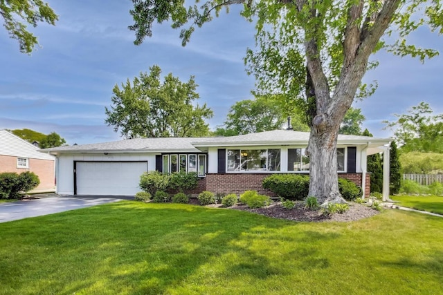 410 W Maude Ave, Arlington Heights, IL 60004 - view of front of property with a garage, brick siding, driveway, and a front lawn