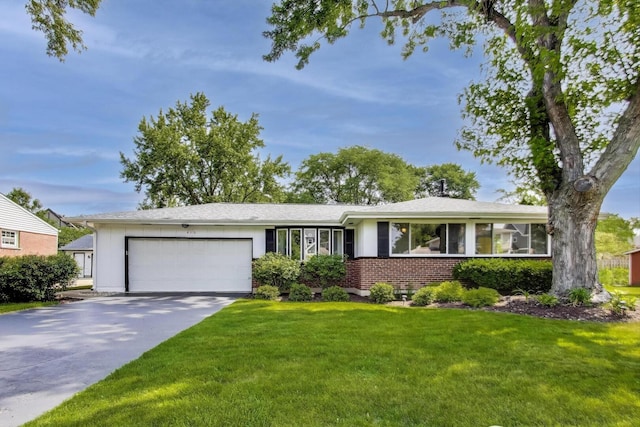 410 W Maude Ave, Arlington Heights, IL 60004 - single story home featuring a garage, a front yard, brick siding, and driveway