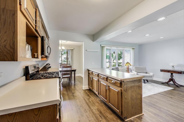 410 W Maude Ave, Arlington Heights, IL 60004 - kitchen with appliances with stainless steel finishes, plenty of natural light, wood finished floors, light countertops, and recessed lighting