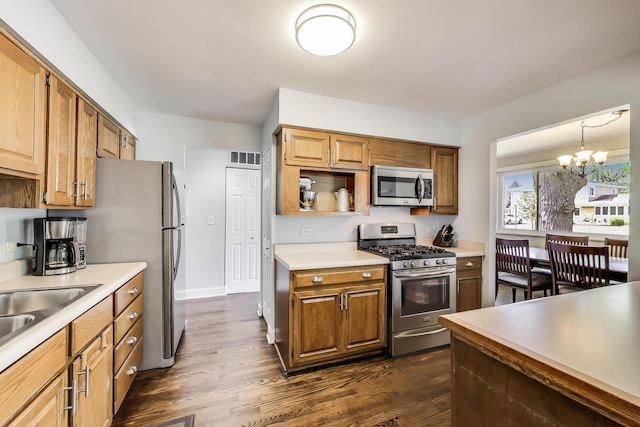 410 W Maude Ave, Arlington Heights, IL 60004 - kitchen featuring stainless steel appliances, light countertops, a chandelier, and dark wood-style flooring