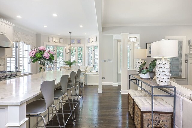 4907 Northcott Ave, Downers Grove, IL 60515 - dining room with decorative columns, recessed lighting, dark wood-type flooring, and crown molding