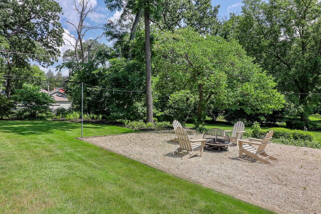 4907 Northcott Ave, Downers Grove, IL 60515 - view of green lawn with a fire pit and a patio