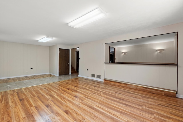 7617 Sycamore Dr, Orland Park, IL 60462 - spare room with light wood finished floors and wooden walls
