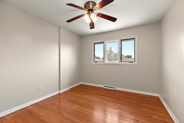 7617 Sycamore Dr, Orland Park, IL 60462 - spare room with a ceiling fan and light wood-type flooring