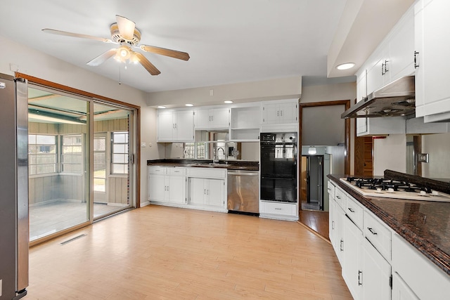 7617 Sycamore Dr, Orland Park, IL 60462 - kitchen with stainless steel appliances, dark countertops, a ceiling fan, light wood finished floors, and white cabinetry
