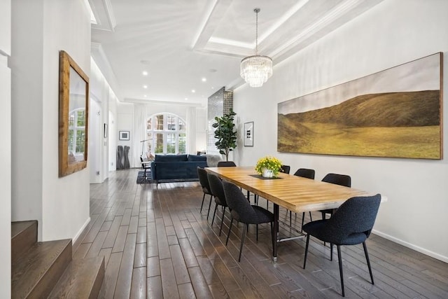 34 E Bellevue Pl, Chicago, IL 60611 - dining area with dark wood-style floors, a chandelier, ornamental molding, and recessed lighting