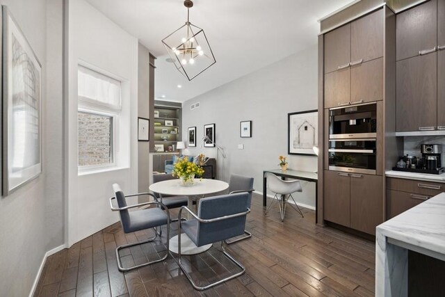 34 E Bellevue Pl, Chicago, IL 60611 - dining room featuring dark wood finished floors and a chandelier