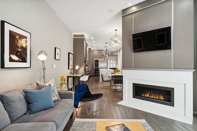 34 E Bellevue Pl, Chicago, IL 60611 - living room with hardwood / wood-style floors, a chandelier, and a fireplace with flush hearth