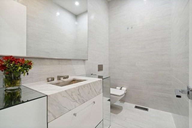 34 E Bellevue Pl, Chicago, IL 60611 - bathroom with tile walls and vanity