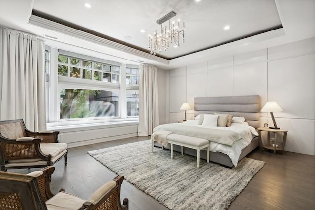 34 E Bellevue Pl, Chicago, IL 60611 - bedroom with a raised ceiling, wood finished floors, a chandelier, and ornamental molding