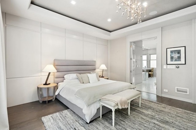 34 E Bellevue Pl, Chicago, IL 60611 - bedroom with a chandelier, wood finished floors, recessed lighting, a raised ceiling, and ensuite bath