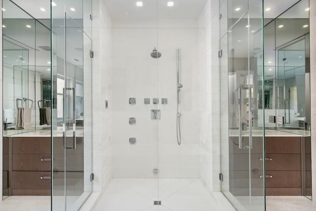 34 E Bellevue Pl, Chicago, IL 60611 - bathroom featuring a stall shower and recessed lighting