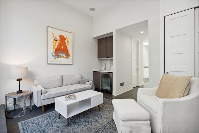 34 E Bellevue Pl, Chicago, IL 60611 - living area featuring beverage cooler, dark wood-style flooring, bar, and recessed lighting