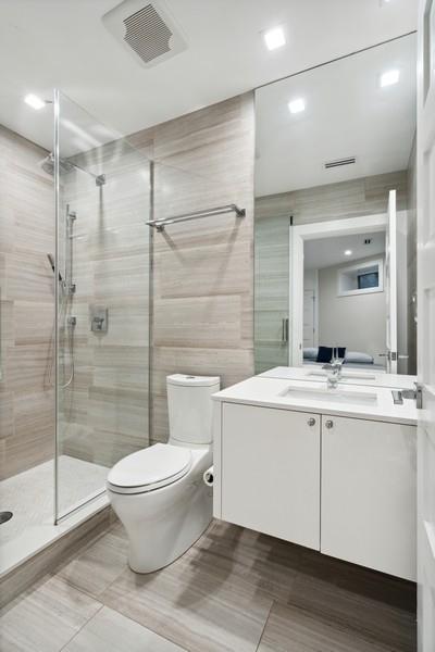 34 E Bellevue Pl, Chicago, IL 60611 - bathroom featuring vanity and a tile shower