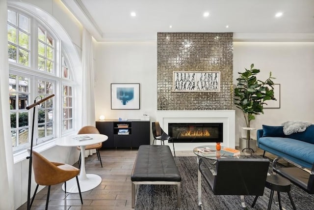 34 E Bellevue Pl, Chicago, IL 60611 - living room featuring wood finished floors, plenty of natural light, ornamental molding, a fireplace, and recessed lighting