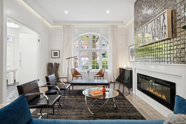 34 E Bellevue Pl, Chicago, IL 60611 - sitting room featuring crown molding, wood finished floors, and a glass covered fireplace