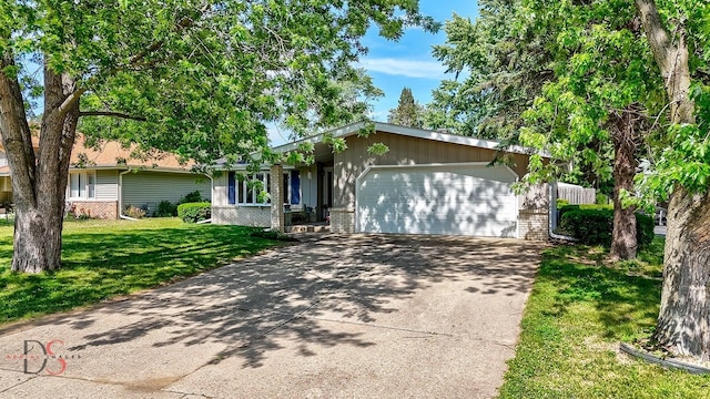 1410 James Ct, Ottawa, IL 61350 - single story home with brick siding, a garage, a front lawn, and driveway