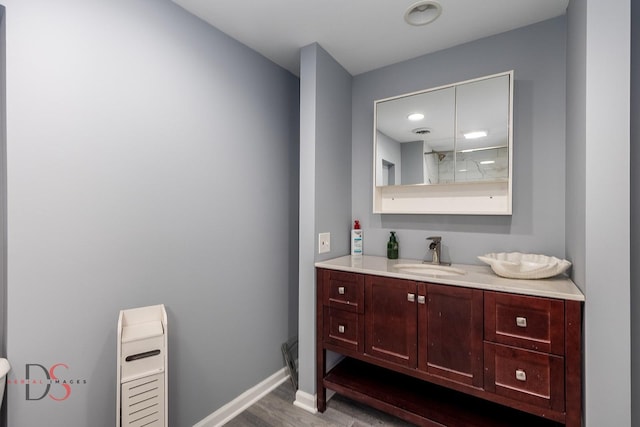 1410 James Ct, Ottawa, IL 61350 - bathroom with vanity and wood finished floors