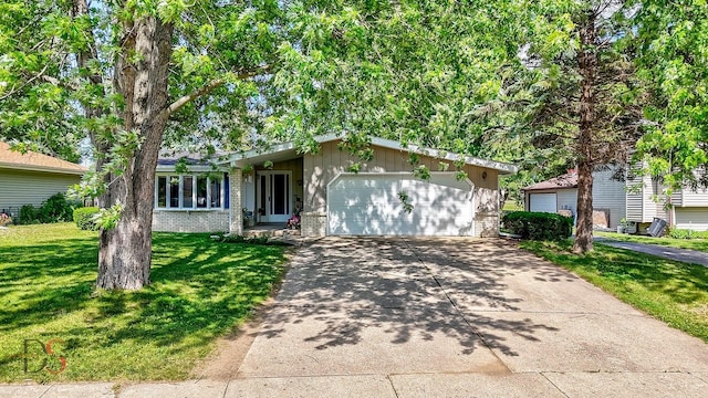 1410 James Ct, Ottawa, IL 61350 - single story home featuring a front lawn, a garage, brick siding, and driveway