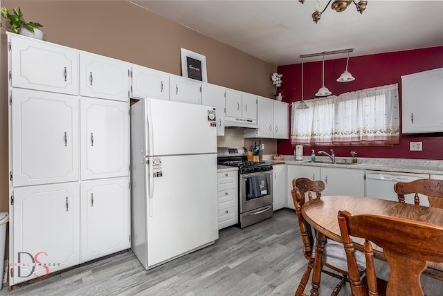 1410 James Ct, Ottawa, IL 61350 - kitchen with white appliances, under cabinet range hood, white cabinets, and light wood finished floors