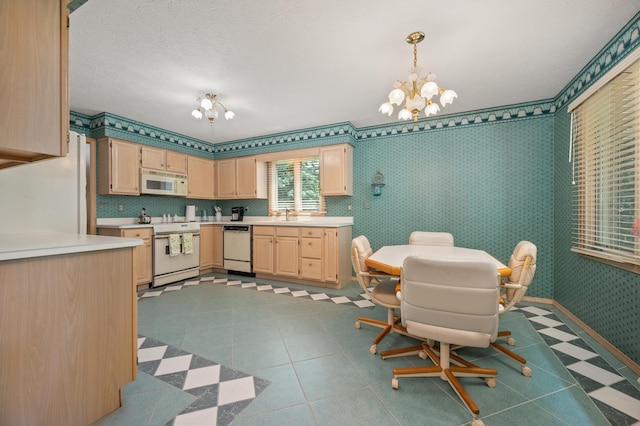 814 Croatian Ct, Sycamore, IL 60178 - kitchen with white appliances, light brown cabinets, a chandelier, light countertops, and decorative light fixtures