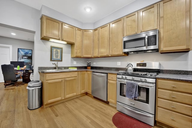 643 W Roscoe St Unit C1, Chicago, IL 60657 - kitchen with stainless steel appliances, light wood-style floors, and light brown cabinets